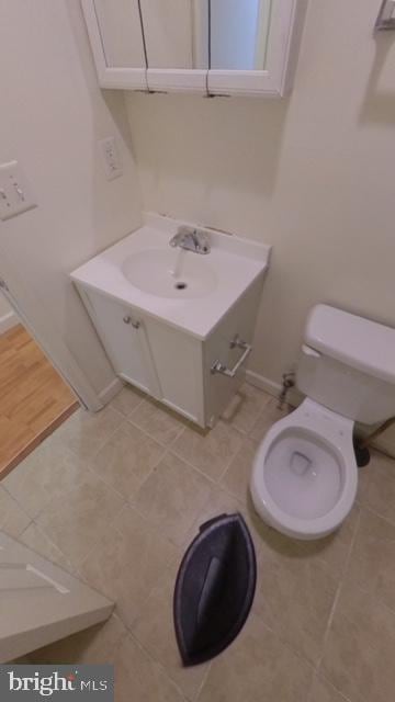 1826 W Diamond St, Philadelphia, PA 19121 - bathroom with vanity, toilet, baseboards, and tile patterned floors