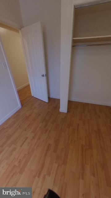 1826 W Diamond St, Philadelphia, PA 19121 - unfurnished bedroom featuring light wood finished floors, baseboards, and a closet