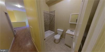 1826 W Diamond St, Philadelphia, PA 19121 - full bath featuring toilet, a shower, baseboards, and a sink