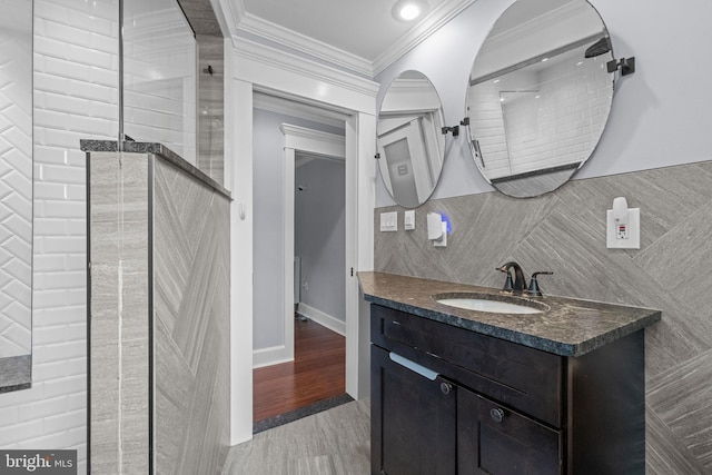 614 Maple Ave, Haddonfield, NJ 08033 - bathroom featuring crown molding, vanity, and tile walls