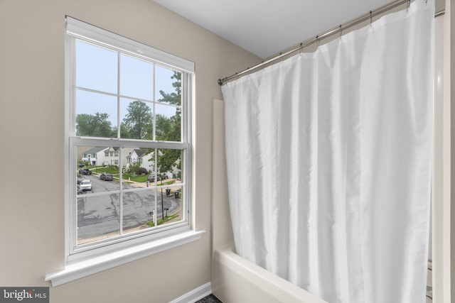 7481 Windswept Ct, Sykesville, MD 21784 - bathroom with shower / bath combo and baseboards