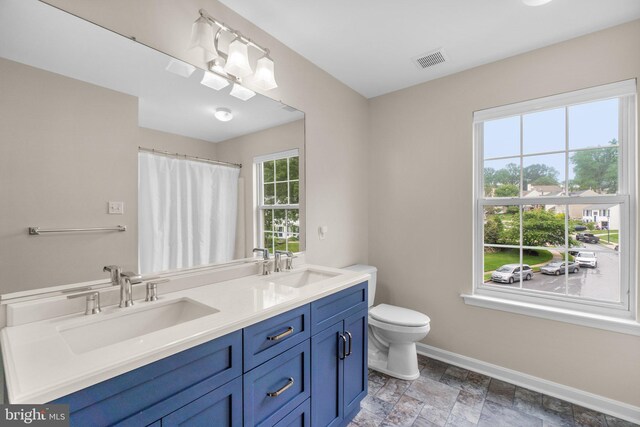 7481 Windswept Ct, Sykesville, MD 21784 - bathroom featuring double vanity, stone finish flooring, and a shower with curtain