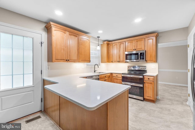 7481 Windswept Ct, Sykesville, MD 21784 - kitchen featuring stainless steel appliances, a peninsula, light countertops, hanging light fixtures, and recessed lighting