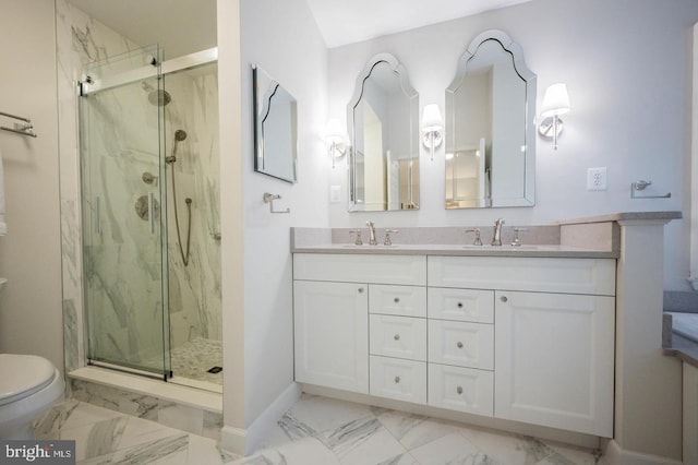 full bath featuring marble finish flooring, toilet, a marble finish shower, baseboards, and double vanity