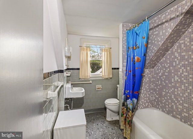 364 Driscoll Ave, Woodbury, NJ 08096 - bathroom featuring tile walls, toilet, a sink, wainscoting, and shower / bathtub combination with curtain