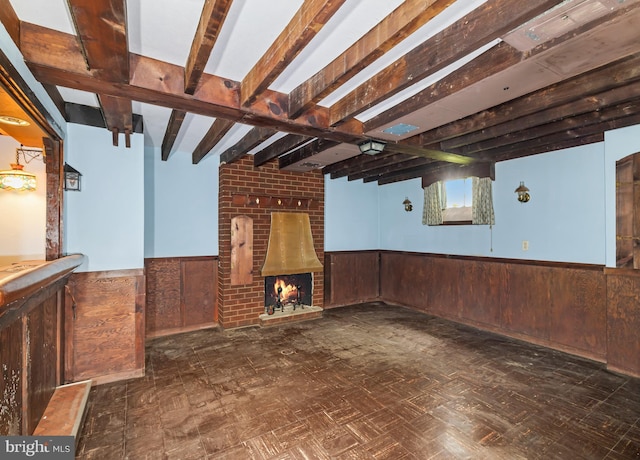 364 Driscoll Ave, Woodbury, NJ 08096 - unfurnished living room featuring wainscoting, wood walls, a brick fireplace, beamed ceiling, and bar area