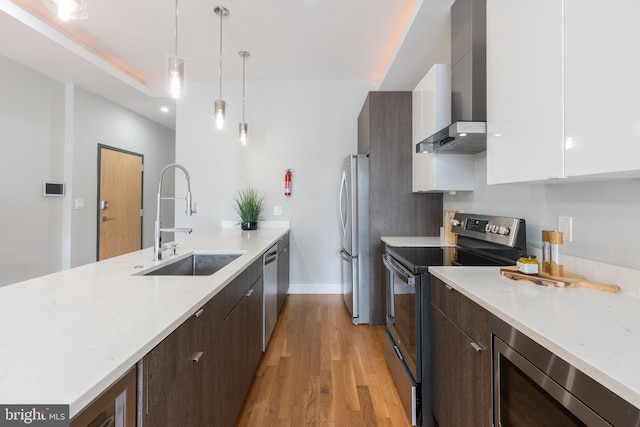 1125 Morse St NE Unit 2, Washington, DC 20002 - kitchen with stainless steel appliances, a sink, wall chimney range hood, modern cabinets, and white cabinets