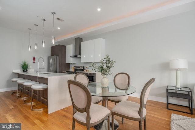 1125 Morse St NE Unit 2, Washington, DC 20002 - dining room with light wood finished floors, baseboards, and recessed lighting