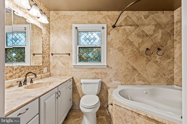 129 Henry Rd, Enola, PA 17025 - full bathroom with tile walls, toilet, vanity, and tiled tub