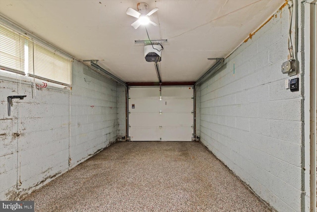 129 Henry Rd, Enola, PA 17025 - garage featuring a garage door opener and concrete block wall