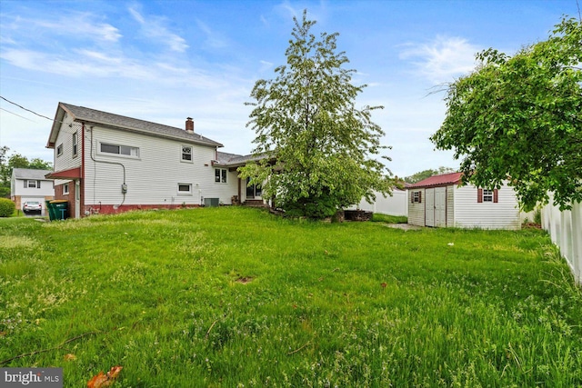 129 Henry Rd, Enola, PA 17025 - back of property with a storage shed, an outbuilding, a chimney, and central AC unit