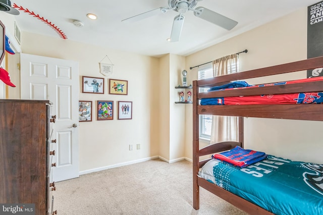 bedroom featuring carpet, baseboards, and a ceiling fan