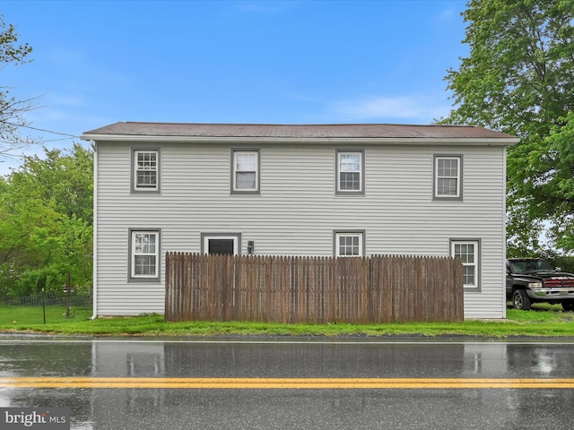 view of side of property with fence