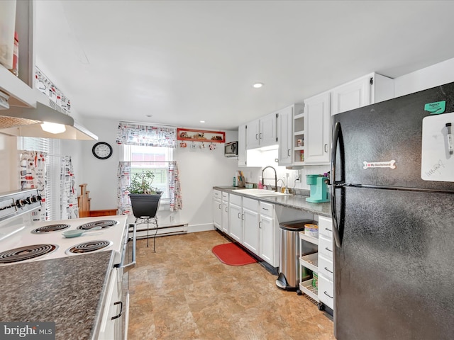 kitchen with freestanding refrigerator, baseboard heating, a sink, white cabinets, and white electric stove