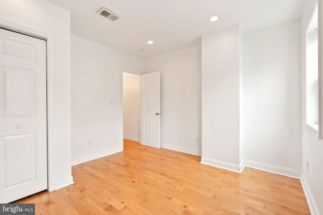 unfurnished bedroom with light wood finished floors, recessed lighting, and baseboards