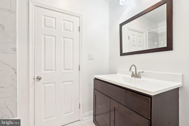 bathroom with vanity and baseboards