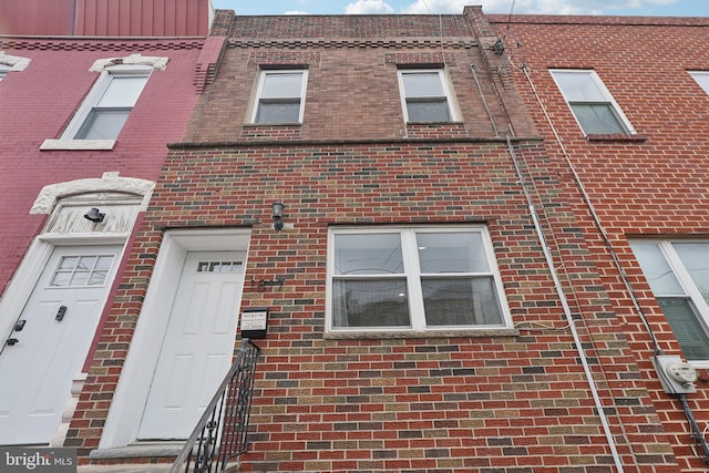 view of front of property featuring brick siding