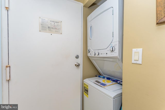 10900 Coastal Hwy Unit 209, Ocean City, MD 21842 - laundry area with stacked washing machine and dryer
