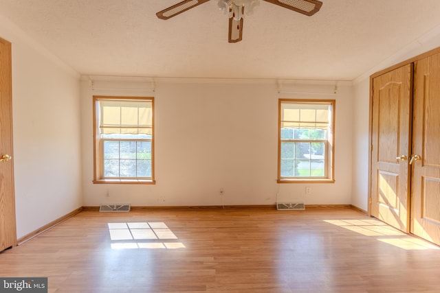 186 Hampton Dr, Chambersburg, PA 17202 - unfurnished room featuring ornamental molding, light wood-type flooring, ceiling fan, baseboards, and a textured ceiling