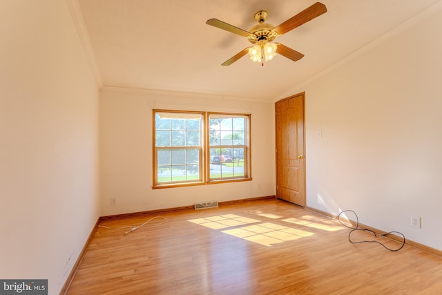 186 Hampton Dr, Chambersburg, PA 17202 - empty room featuring crown molding, wood finished floors, a ceiling fan, baseboards, and vaulted ceiling