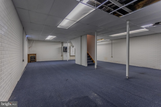 186 Hampton Dr, Chambersburg, PA 17202 - finished basement with brick wall, stairs, carpet floors, electric panel, and a paneled ceiling