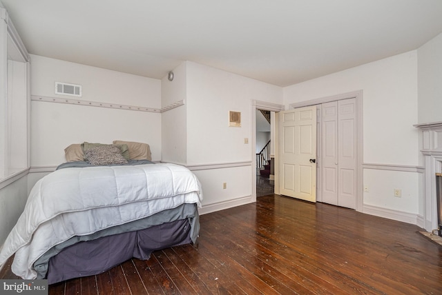 1554 Williams Grove Rd, Mechanicsburg, PA 17055 - bedroom featuring wood-type flooring, baseboards, and a fireplace