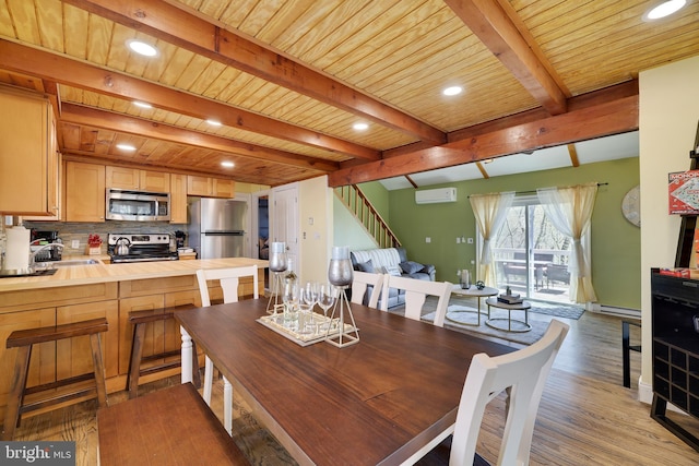 dining space featuring light wood finished floors, stairs, beam ceiling, baseboard heating, and a wall mounted AC