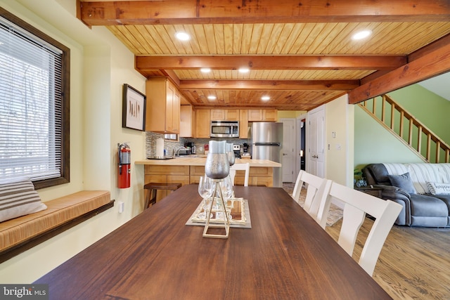 dining space featuring wooden ceiling, beamed ceiling, stairway, wood finished floors, and recessed lighting