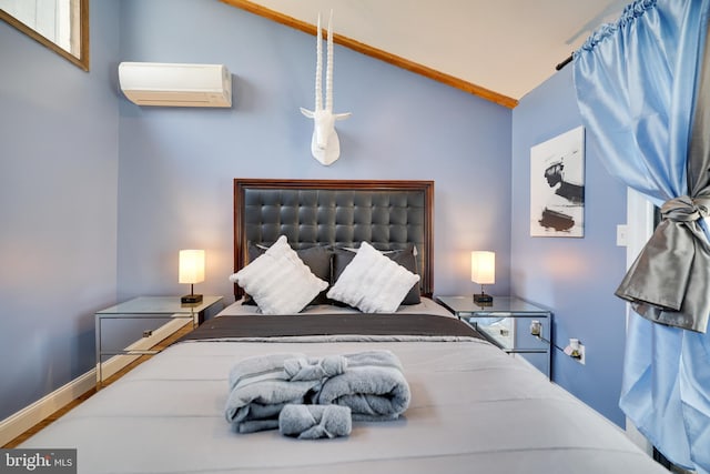 bedroom with a wall unit AC, lofted ceiling, and baseboards
