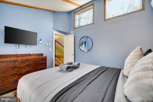 bedroom featuring a towering ceiling