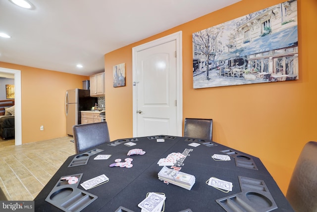 dining room with recessed lighting