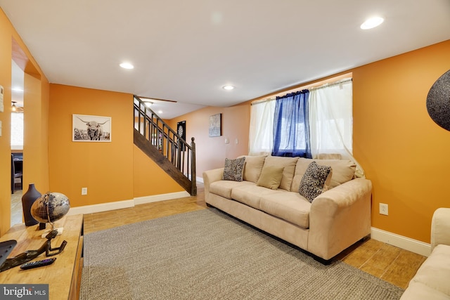 living area with wood finished floors, stairs, recessed lighting, and baseboards