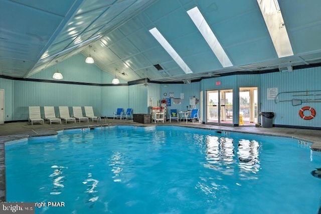 indoor pool featuring a skylight