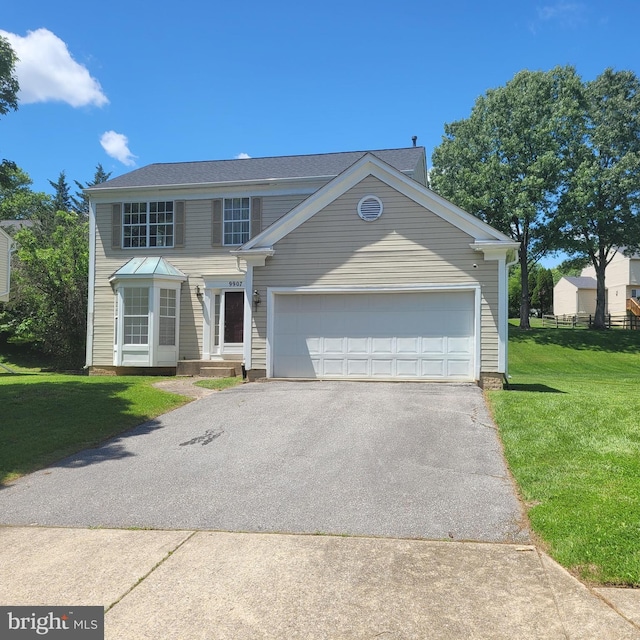 traditional home featuring driveway, a front yard, and a garage