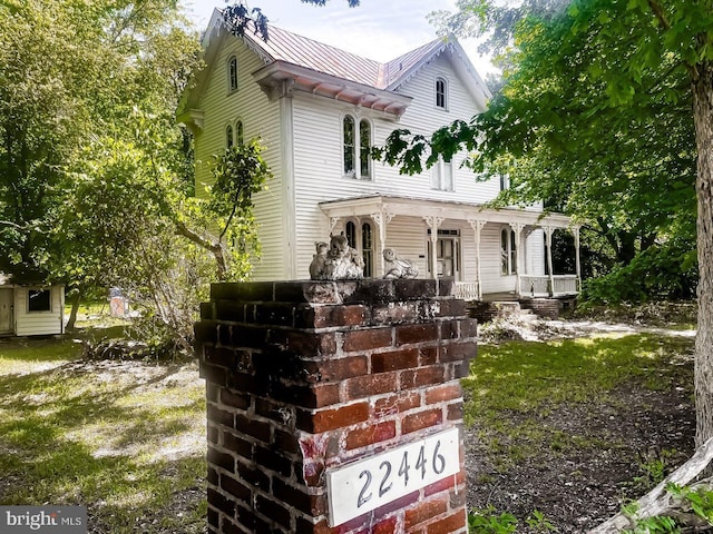 22446E Depot St, Newsoms, VA 23874 - view of front facade featuring covered porch and metal roof