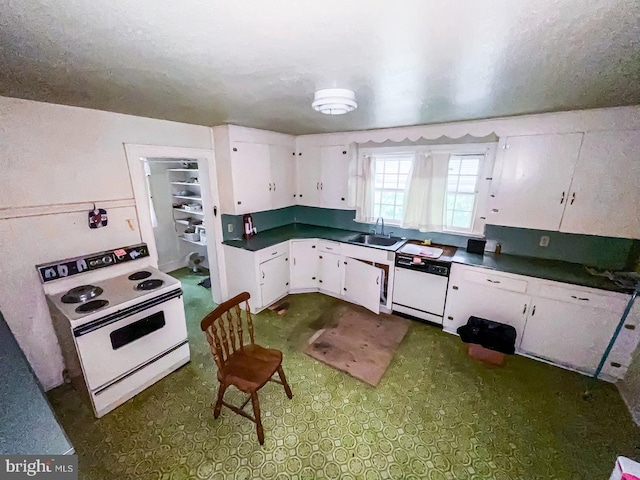 22446E Depot St, Newsoms, VA 23874 - kitchen featuring white appliances, a sink, white cabinets, and dark countertops