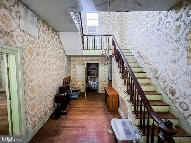 22446E Depot St, Newsoms, VA 23874 - stairway with wallpapered walls, wood finished floors, cooling unit, and baseboards