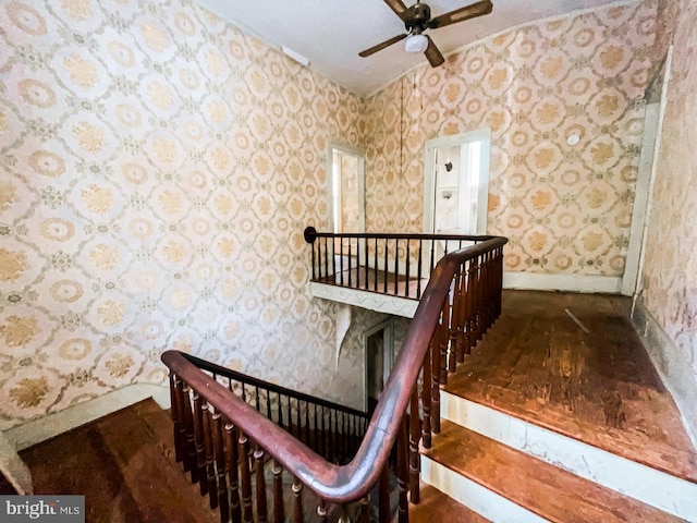 22446E Depot St, Newsoms, VA 23874 - staircase featuring baseboards, a ceiling fan, and wallpapered walls