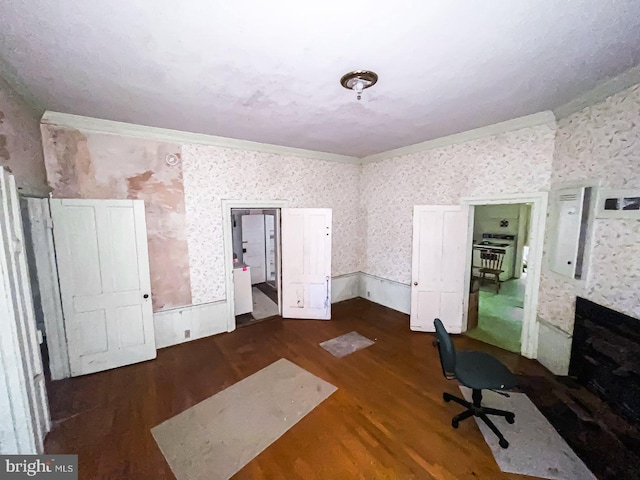 22446E Depot St, Newsoms, VA 23874 - miscellaneous room with wallpapered walls, wood finished floors, and crown molding