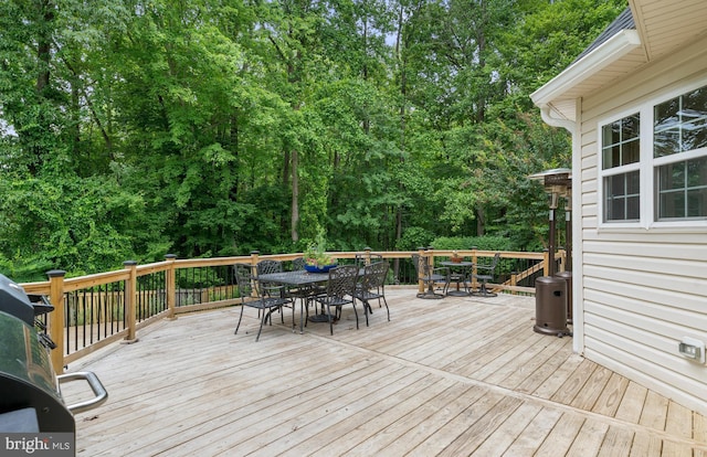 3740 Devin Ct, Huntingtown, MD 20639 - wooden terrace with outdoor dining space and view of wooded area