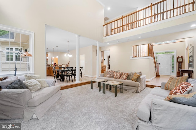 3740 Devin Ct, Huntingtown, MD 20639 - living area featuring a towering ceiling, stairway, baseboards, decorative columns, and recessed lighting