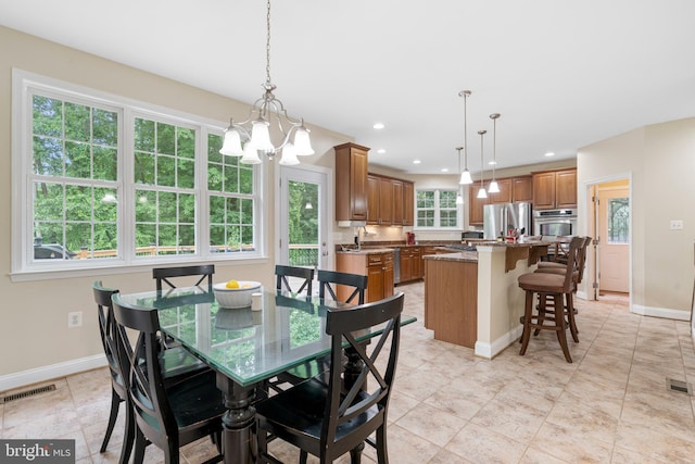 3740 Devin Ct, Huntingtown, MD 20639 - dining space with baseboards, a chandelier, and recessed lighting