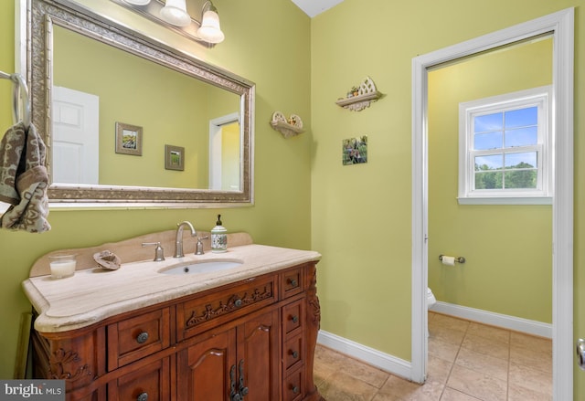 3740 Devin Ct, Huntingtown, MD 20639 - bathroom featuring baseboards, vanity, toilet, and tile patterned flooring