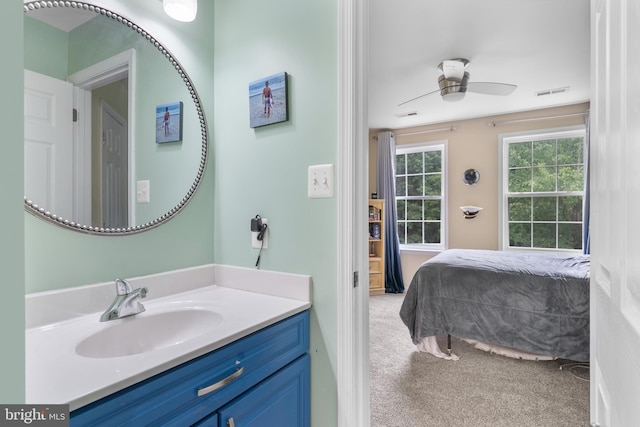 3740 Devin Ct, Huntingtown, MD 20639 - bathroom with vanity, ceiling fan, and connected bathroom