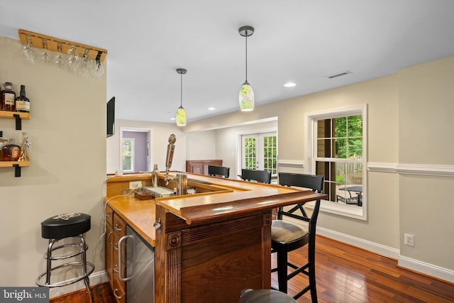 3740 Devin Ct, Huntingtown, MD 20639 - indoor dry bar with dark wood finished floors, baseboards, refrigerator, decorative light fixtures, and recessed lighting