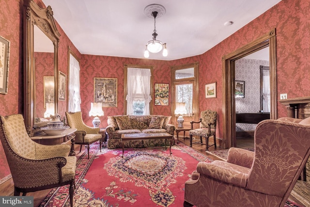3911 Prospect St, Kensington, MD 20895 - living room featuring wallpapered walls, wood finished floors, and baseboards