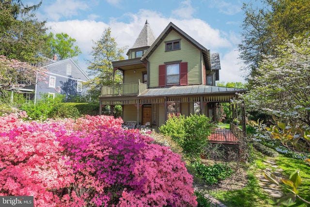 3911 Prospect St, Kensington, MD 20895 - victorian home with a porch, a standing seam roof, and metal roof