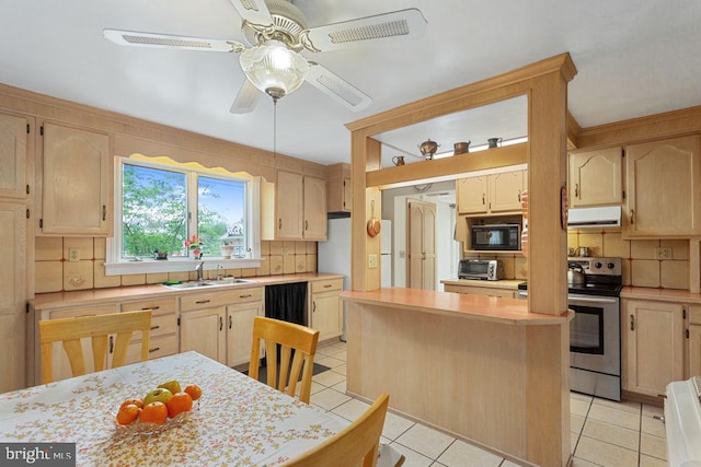121 S Central St, Broadway, VA 22815 - kitchen with black microwave, range hood, stainless steel electric stove, a sink, and backsplash