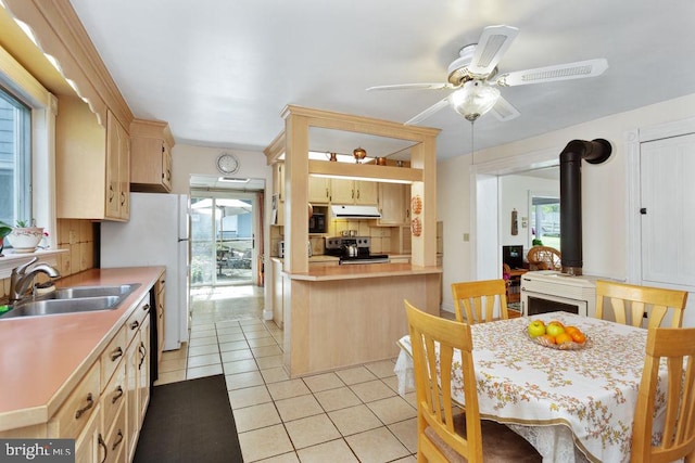 121 S Central St, Broadway, VA 22815 - kitchen featuring electric range, under cabinet range hood, a sink, light brown cabinets, and light tile patterned floors