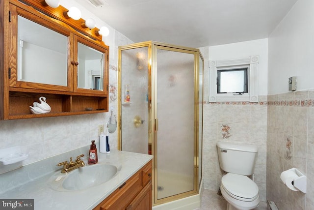 121 S Central St, Broadway, VA 22815 - bathroom featuring tile walls, a shower stall, vanity, toilet, and tile patterned floors